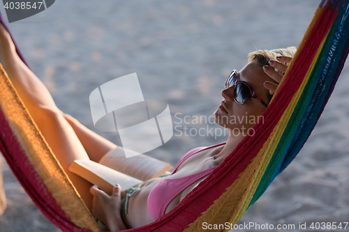 Image of relaxed woman laying in hammock