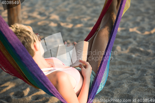 Image of relaxed woman laying in hammock