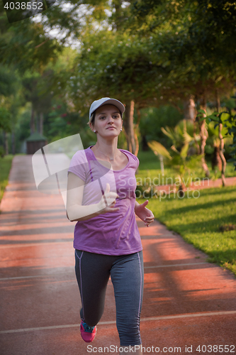 Image of sporty woman jogging