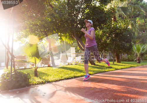 Image of sporty woman jogging