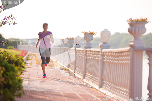 Image of sporty woman jogging