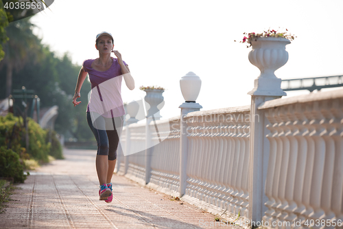 Image of sporty woman jogging