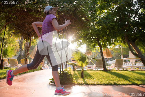 Image of sporty woman jogging