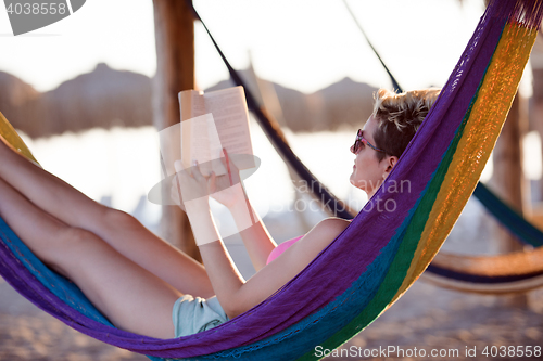 Image of relaxed woman laying in hammock