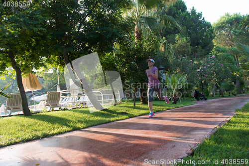 Image of sporty woman jogging