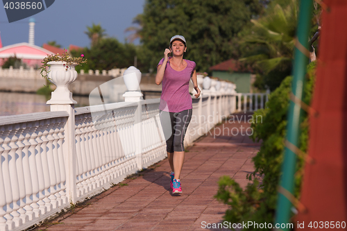Image of sporty woman jogging