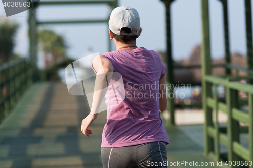 Image of sporty woman jogging