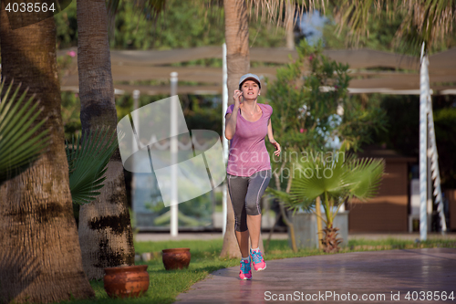 Image of sporty woman jogging