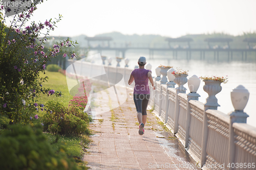 Image of sporty woman jogging