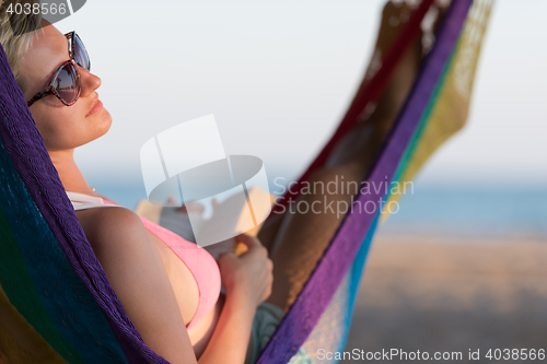 Image of relaxed woman laying in hammock