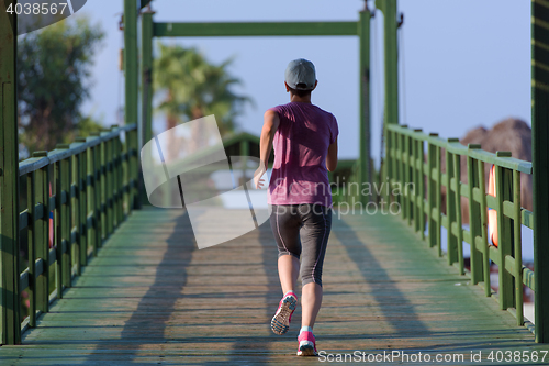 Image of sporty woman jogging