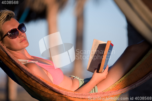 Image of relaxed woman laying in hammock