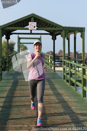 Image of sporty woman jogging