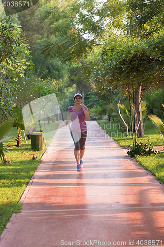 Image of sporty woman jogging