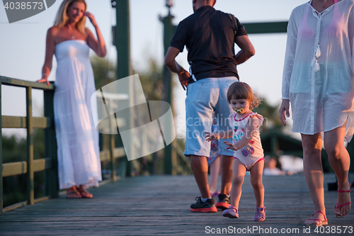 Image of girl and mother walking