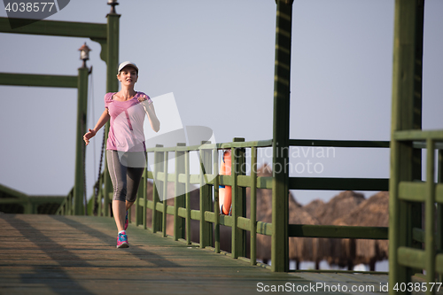 Image of sporty woman jogging