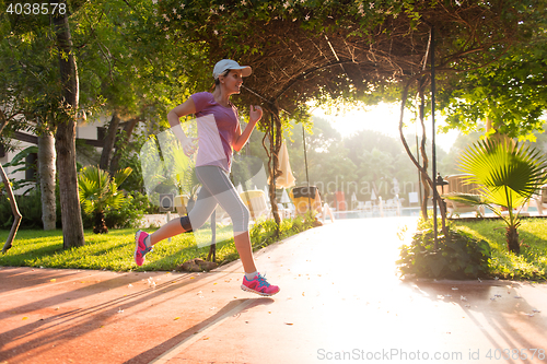Image of sporty woman jogging