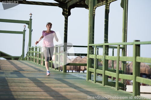 Image of sporty woman jogging