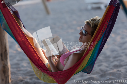 Image of relaxed woman laying in hammock