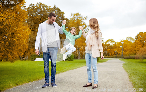 Image of happy family walking in summer park and having fun