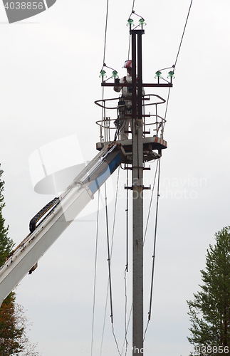Image of Electrician working at a pillar