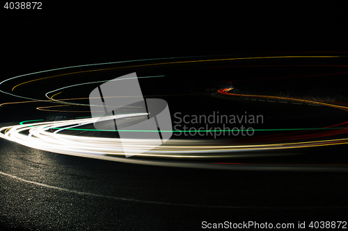 Image of Bright car lines on night road