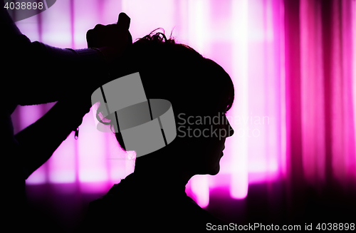 Image of Silhouette Of A Woman At The Hairdresser