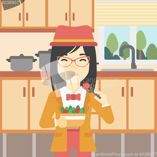 Image of Woman eating healthy vegetable salad.