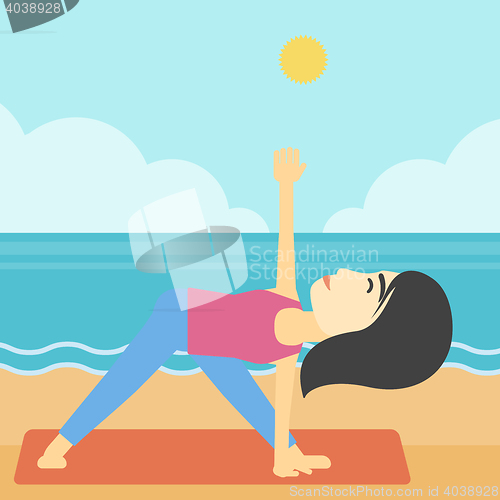 Image of Woman practicing yoga triangle pose on the beach.