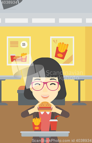 Image of Woman eating hamburger vector illustration.