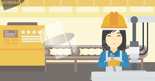 Image of Woman working on industrial drilling machine.