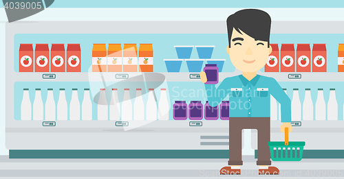Image of Customer with shopping basket and tube of cream.