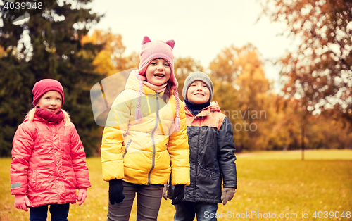 Image of group of happy children in autumn park