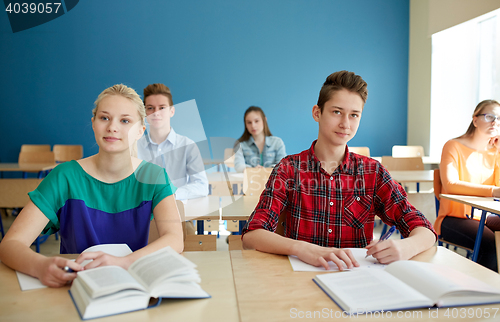 Image of group of students with books at school lesson