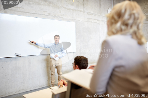 Image of group of students and teacher at lecture