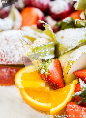 Image of close up of dish with sugared fruit dessert