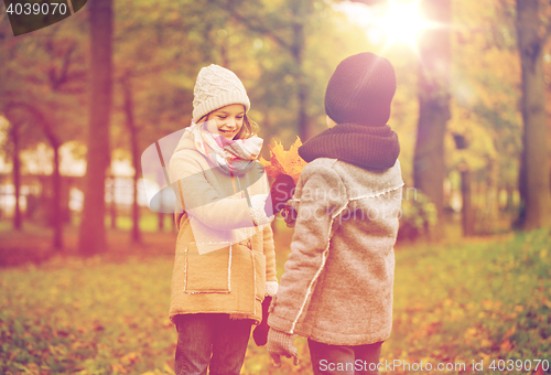 Image of smiling children in autumn park