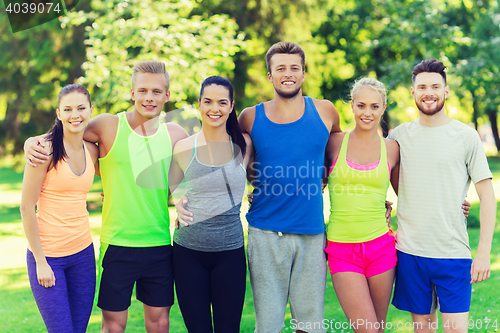 Image of group of happy friends or sportsmen outdoors