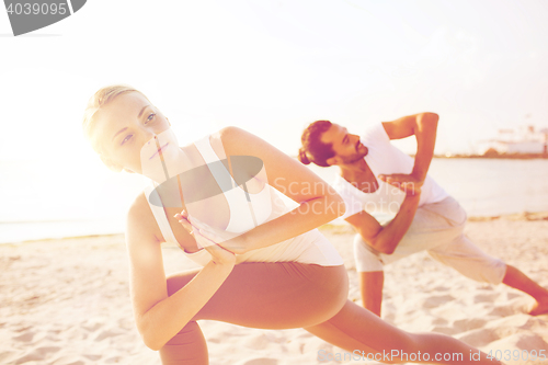 Image of close up of couple making yoga exercises outdoors