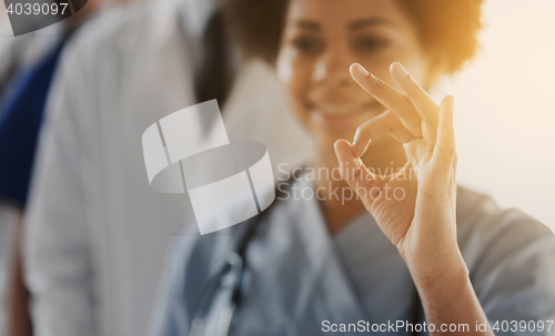 Image of close up of doctor or nurse showing ok sign