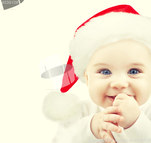 Image of happy baby in santa hat