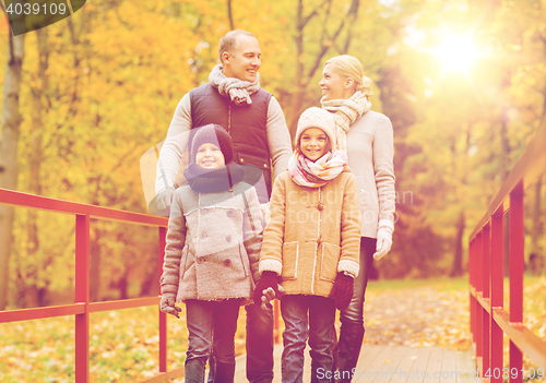 Image of happy family in autumn park