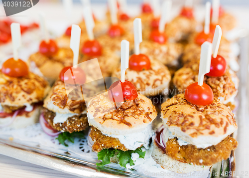 Image of close up of canape hamburgers on serving tray