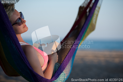 Image of relaxed woman laying in hammock