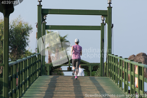 Image of sporty woman jogging