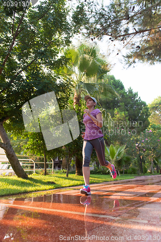 Image of sporty woman jogging