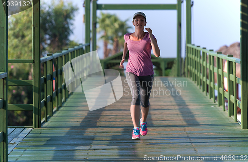 Image of sporty woman jogging