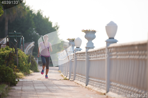 Image of sporty woman jogging