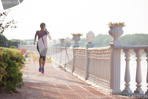 Image of sporty woman jogging