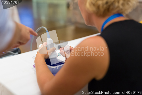 Image of Medical doctor student learning to use ultra sound scanner machine.